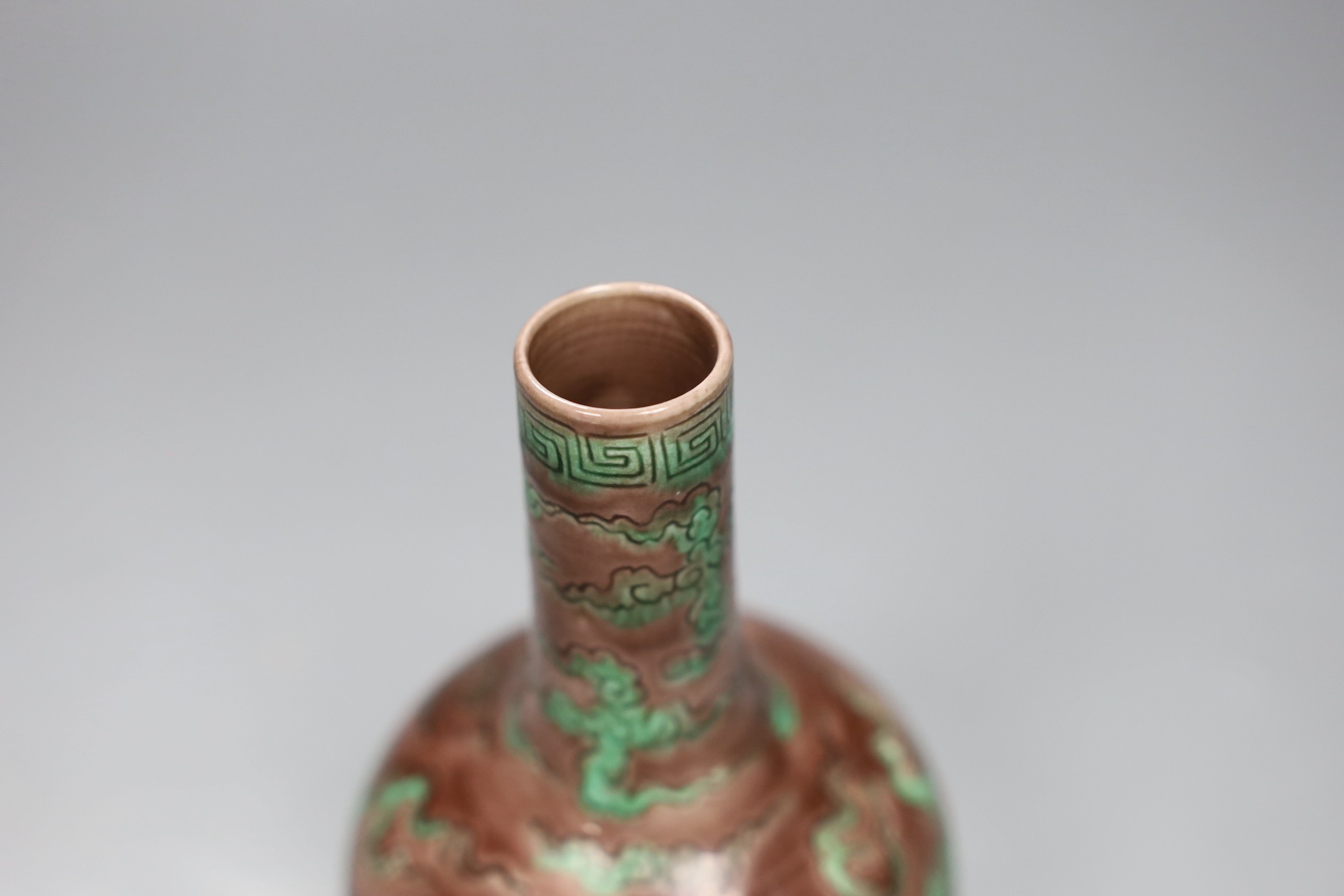 A Chinese aubergine and green glazed 'dragon' bottle vase, 14cm tall